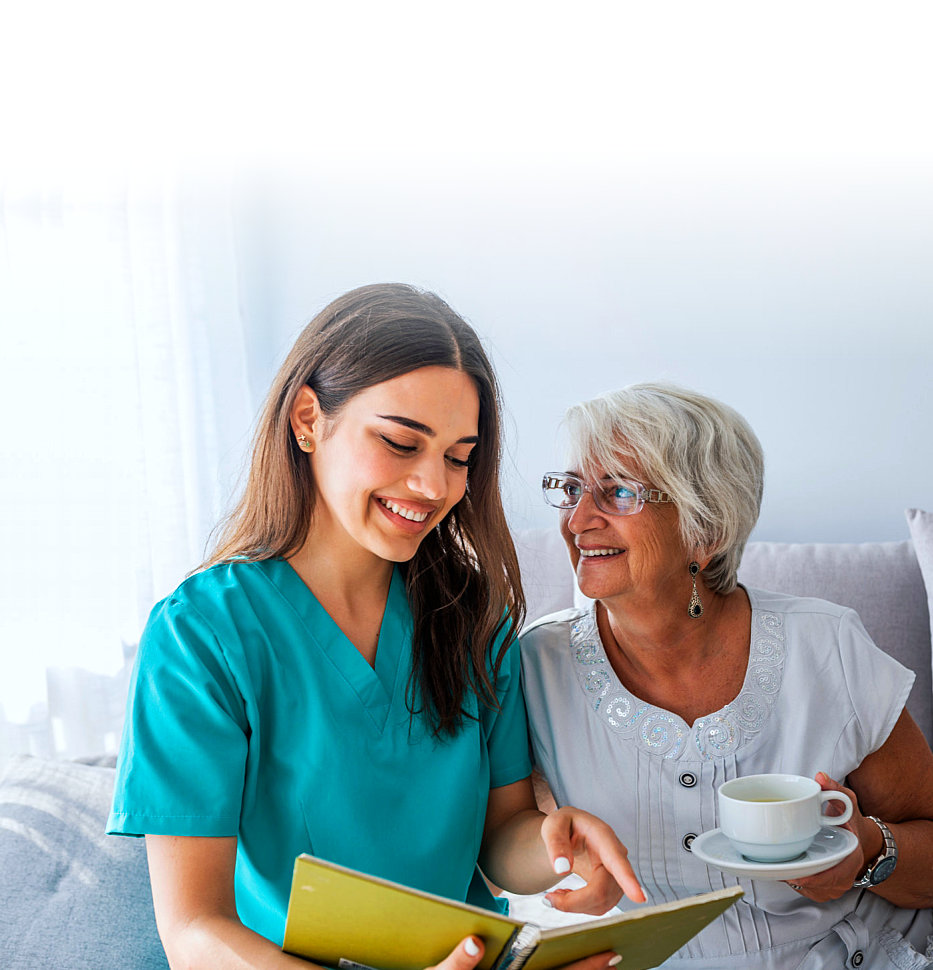 caregiver reading a book with her patient