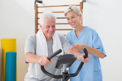senior man exercising with his caregiver